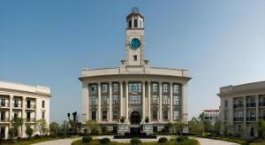 a building with a clock tower on top of it at Wuhan Zall Royal Hotel- North Hankou International Hotel in Wuhan