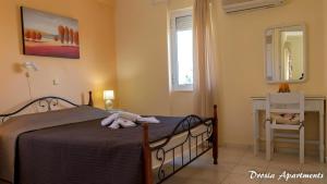 Postel nebo postele na pokoji v ubytování Drosia Apartments