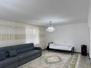 a living room with a couch and a table at Rustic Bliss  +9 photos