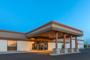 a store front of a building with columns at Baymont by Wyndham Jamestown Conference Center & Water Park in Jamestown