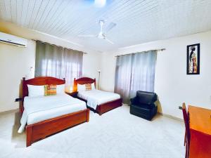 Letto o letti in una camera di Coconut Pointe Villa & Beach Resort