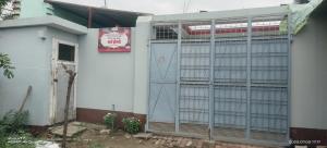 a building with a gate and a door at Sharma Homestay in Kālīnagar +7 photos