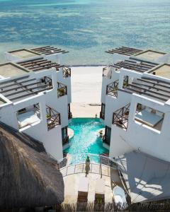 an aerial view of a resort on the beach at Pili Pili Tropical Island in Jambiani
