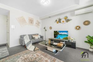 Ένα ή περισσότερα κρεβάτια σε δωμάτιο στο Hurstville CBD Changda Apartment