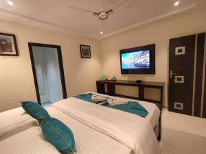 Postel nebo postele na pokoji v ubytování Jazzy Beach Guest Rooms