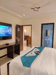 TV a/nebo společenská místnost v ubytování Jazzy Beach Guest Rooms