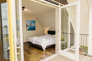 Giường trong phòng chung tại Meervilla | 6 personen - Boutique Parc Pharshoeke +33 ảnh