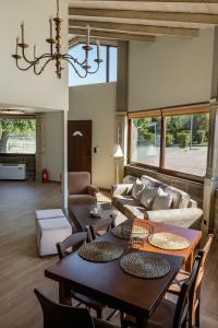 a living room with a table and a couch at LOTOS Families Αpartments 1 in Konitsa