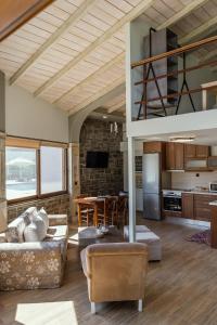 a living room with a couch and a table at LOTOS Families Αpartments 1 in Konitsa
