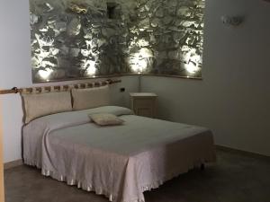 Postel nebo postele na pokoji v ubytování Foresteria La Ceriola + 8 fotografií