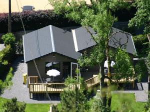 an aerial view of a house with a deck at Scenic chalet in Vieuxville with terrace in Vieuxville