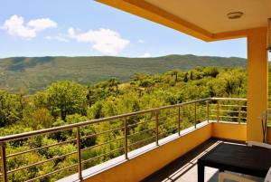a balcony with a view of the mountains at Crypto Hills Montenegro in Herceg-Novi