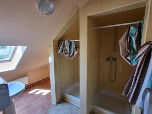 a bathroom with a shower and a sink at Szkolne Schronisko Młodzieżowe w Hucie Starej in Huta Stara +22 photos