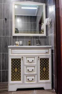 a bathroom with a white sink and a mirror at ZhanaOtel Hotel in Aktau +23 photos
