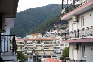 a group of buildings with mountains in the background at Aurora Suite in Xanthi