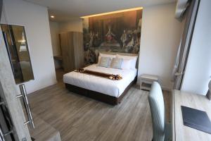 Postel nebo postele na pokoji v ubytování Bright Hotel