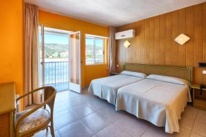 Postel nebo postele na pokoji v ubytování Hotel Marina