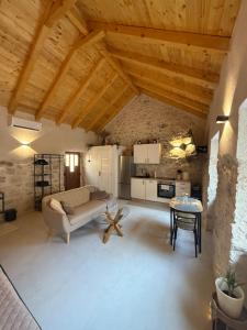 a living room with a couch and a table at The Hideaway - Kastel Novi in Kaštela