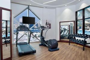 a gym with a view of a city at City Seasons Towers Hotel Bur Dubai in Dubai