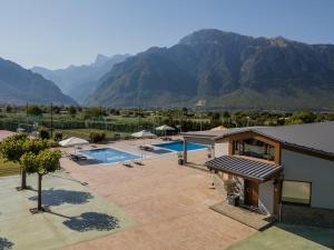an aerial view of a resort with mountains in the background at LOTOS Families Apartments 4 in Konitsa