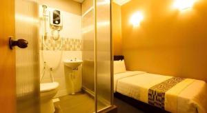 Koupelna v ubytování RAINFOREST Budget Stay