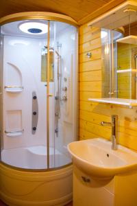 a bathroom with a shower and a sink at Porto Marine in Jūrmala