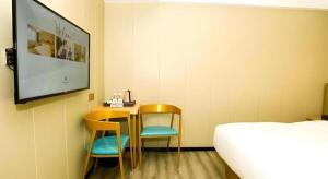 Postel nebo postele na pokoji v ubytování Borrman Hotel Xiamen Xiang'an Maxiang