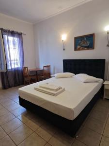 Postel nebo postele na pokoji v ubytování Hera Hotel