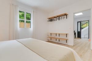 En eller flere senge i et værelse på Casa Teixeira by Holiday Rental Madeira