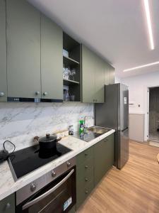 Kuchyň nebo kuchyňský kout v ubytování 3M Luxury Apartments