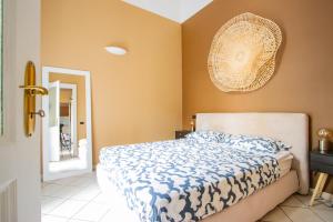 Ένα ή περισσότερα κρεβάτια σε δωμάτιο στο Eleganza e comfort nel cuore di Torino a due passi da Porta Nuova e dal Museo Egizio