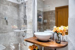 a bathroom with a sink and a shower at Di Martino Residence in Rome +35 photos