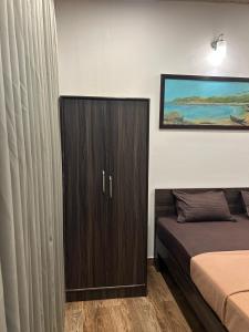 Ένα ή περισσότερα κρεβάτια σε δωμάτιο στο FabHotel Coco Homes