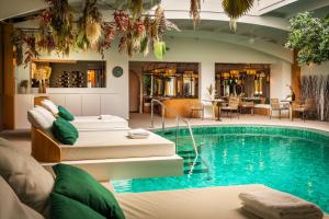 a hotel room with a swimming pool and a spa at Atlantic Hôtel & Spa in Les Sables-d'Olonne