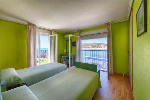 Postel nebo postele na pokoji v ubytování Hotel Marina
