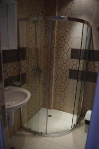 a bathroom with a shower and a sink at Admiral Plaza Apartments in Sunny Beach