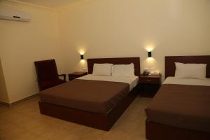 Ліжко або ліжка в номері Rumman Hotel