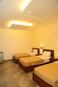 Ліжко або ліжка в номері Rumman Hotel