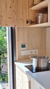 a kitchen with a pot on top of a stove at mini mal anders in Altmannstein