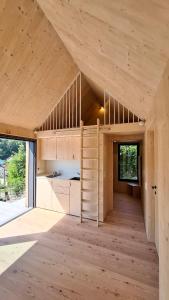 a large wooden room with a bunk bed in it at mini mal anders in Altmannstein