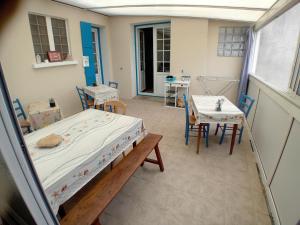 a hospital room with a bed and a table at Pluie de roses in Royan