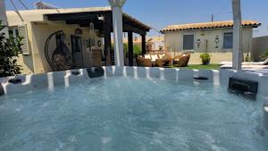 a swimming pool in the backyard of a house at Agave Villa's Fronte Mare in Ispica