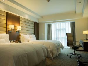 Postel nebo postele na pokoji v ubytování Swissotel Lima