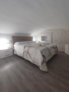Ένα ή περισσότερα κρεβάτια σε δωμάτιο στο Il canto del mare