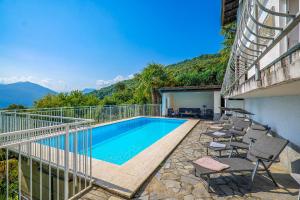 a swimming pool on the balcony of a house at Casa Cora in Agra