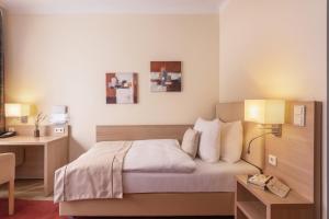 Postel nebo postele na pokoji v ubytování Garner Hotel Hamburg - Wandsbek Marktplatz by IHG