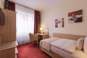 Postel nebo postele na pokoji v ubytování Garner Hotel Hamburg - Wandsbek Marktplatz by IHG