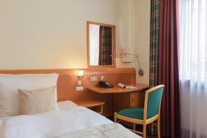 Postel nebo postele na pokoji v ubytování Garner Hotel Hamburg - Wandsbek Marktplatz by IHG