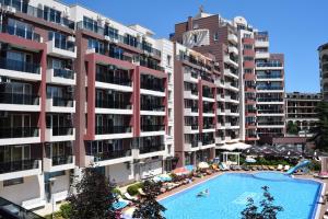 an overhead view of a large apartment building with a swimming pool at Admiral Plaza Apartments in Sunny Beach