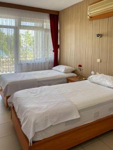 Katil atau katil-katil dalam bilik di Anamur Nice Hotel